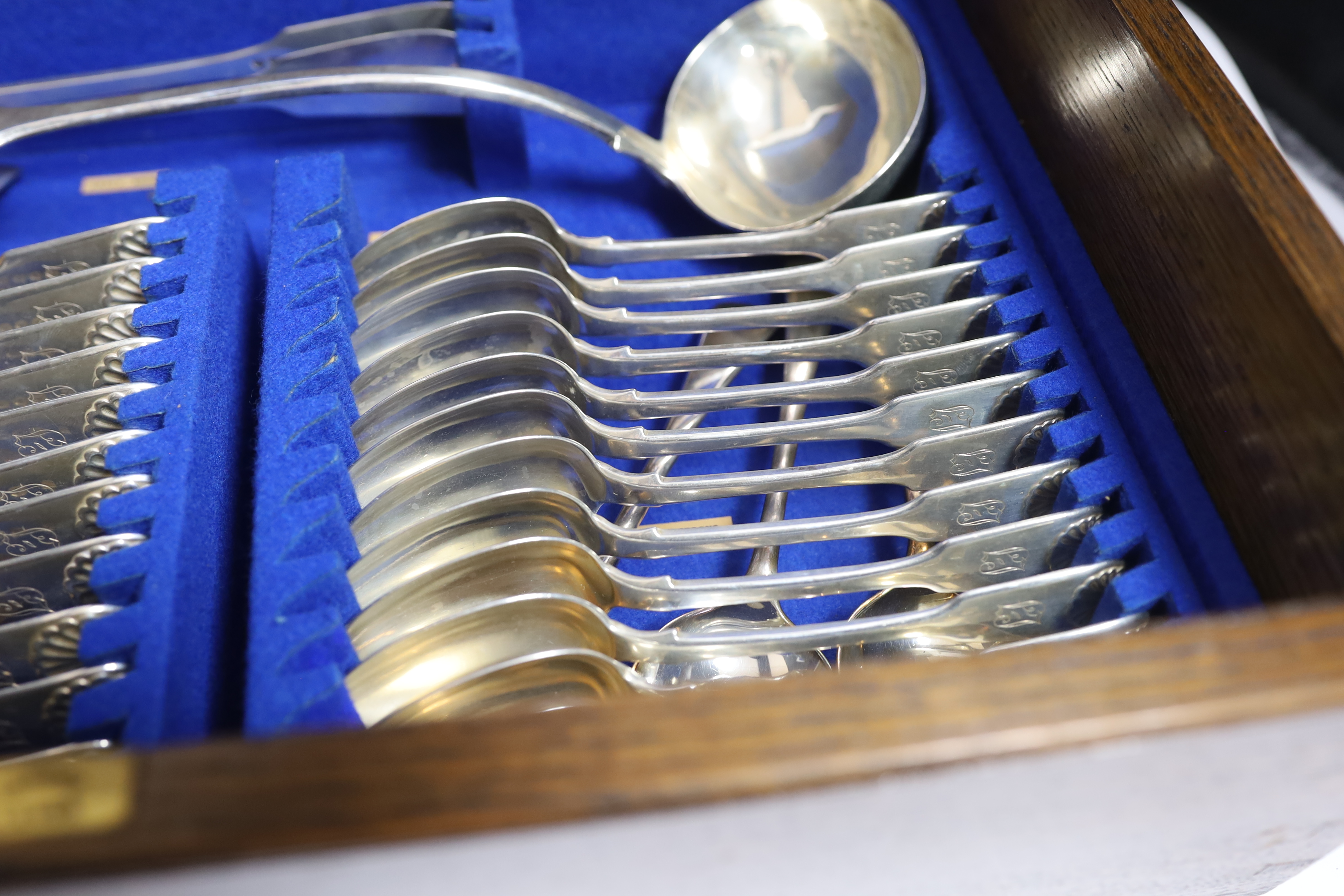 A Victorian oak cased matched canteen of silver fiddle and shell pattern flatware, by John & Henry - Image 10 of 10