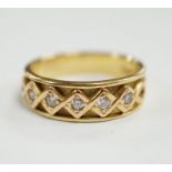 A modern 18ct gold and five stone diamond set half hoop ring, size O, gross weight 6.2 grams.