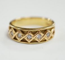 A modern 18ct gold and five stone diamond set half hoop ring, size O, gross weight 6.2 grams.