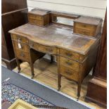 An Edwardian marquetry inlaid rosewood bow front kneehole desk, width 114cm, depth 62cm, height