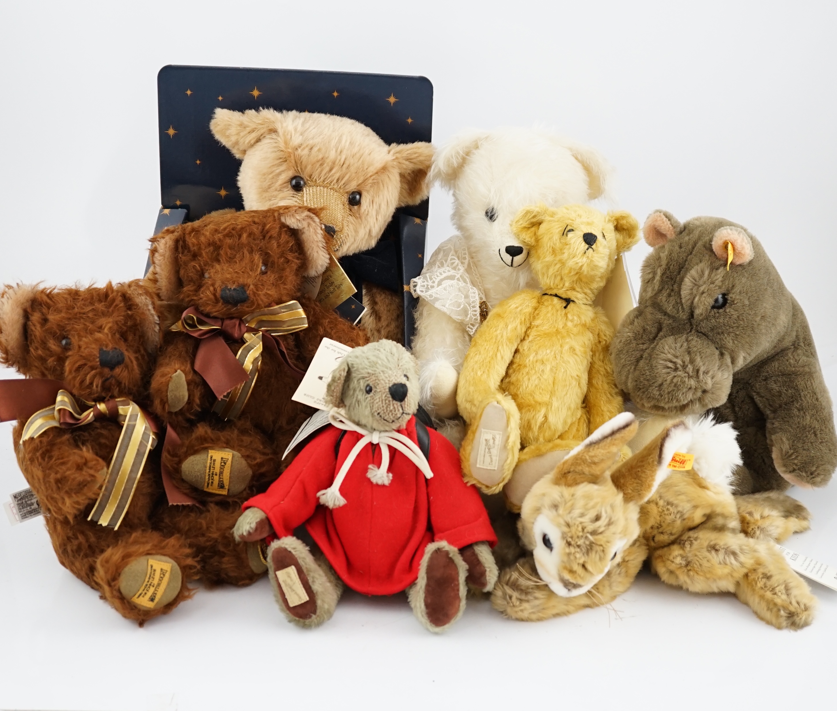 Two Merrythought John Lewis bears, a Harrodd 2000 bear, a Steiff yellow tag rabbit, two Deans bears,