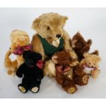 A large 1906 Steiff orange label, two Merrythought John Lewis bears, a black Merrythought bear, an