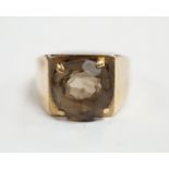 A 9ct gold and single stone oval cut smoky cut quartz set ring, size H, gross weight 4.5 grams.