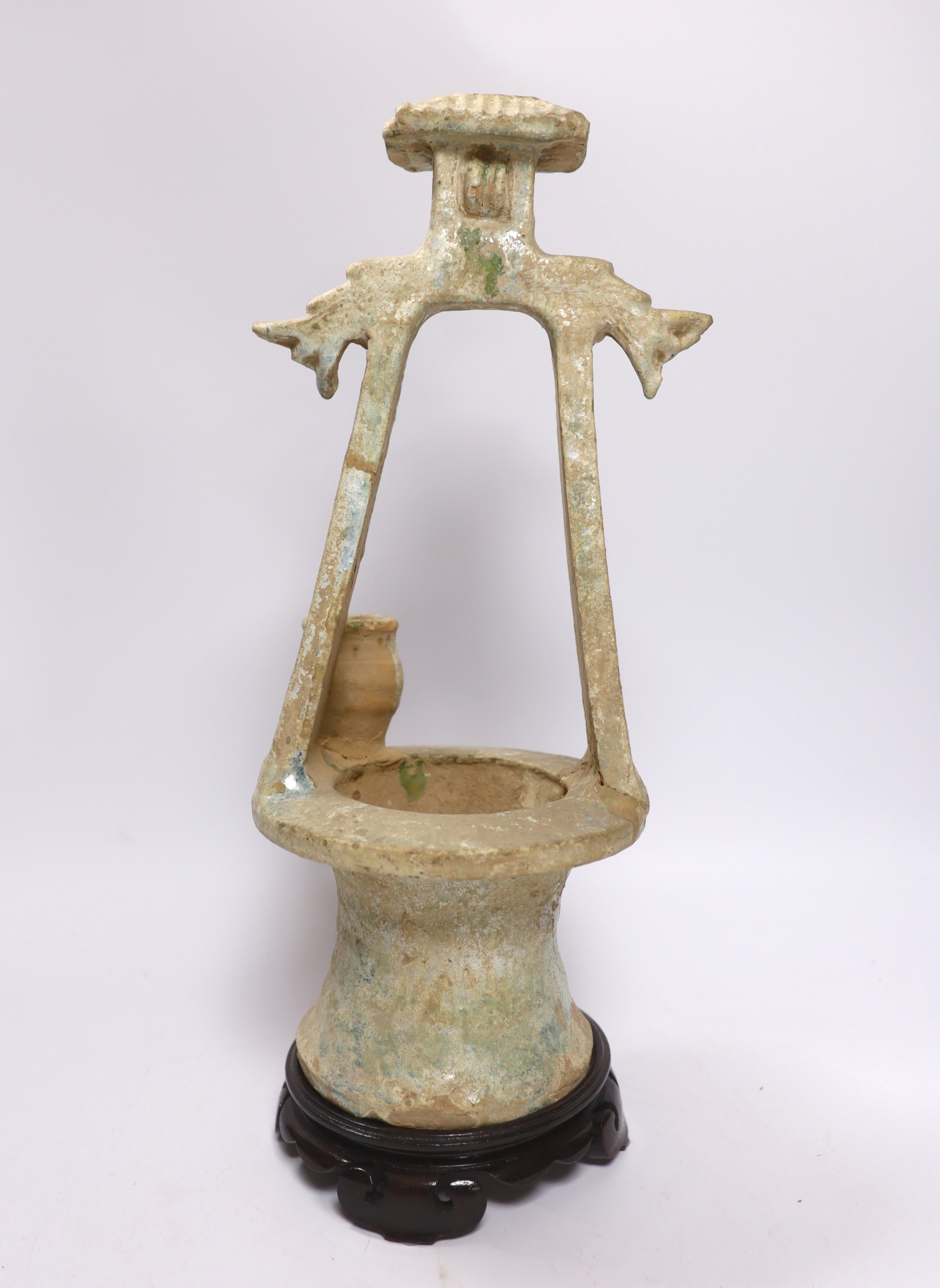 A Chinese glazed pottery model of a well, Han dynasty, with mineral iridescence, stand, 37cm high - Image 3 of 3