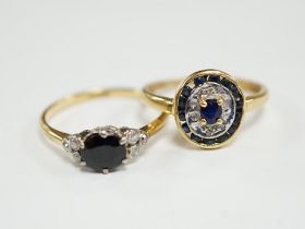 An 18ct, sapphire and diamond set seven stone ring, size P and a French 18k and sapphire set oval