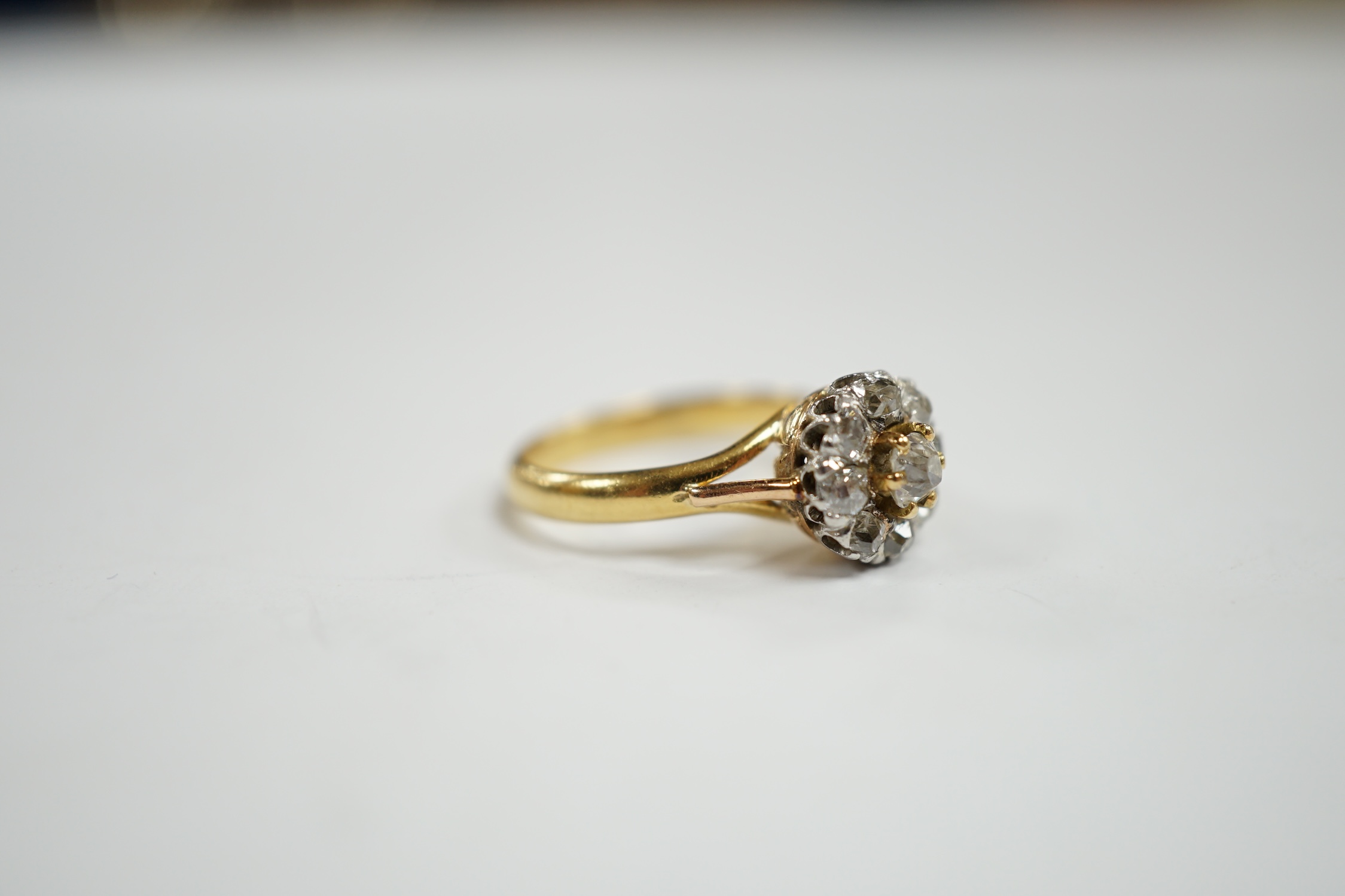 An early 20th century French 18k and nine stone diamond set flower head cluster ring, size G, - Image 4 of 5