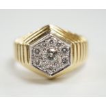 A modern 18ct gold and diamond set hexagonal cluster ring, size Q, gross weight 11.3 grams.