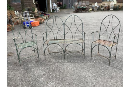 A painted wrought iron Gothic style three piece garden suite, bench width 109cm, depth 44cm,