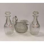 A Regency hobnail and slice cut jug and a pair of Regency cut glass mallet shaped decanters with ‘’