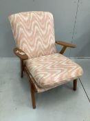 A mid century Parker Knoll oak armchair, width 64cm, depth 60cm, height 80cm. Condition - good