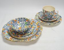 From the Studio of Fred Cuming. A Rainbow pottery tea set including sandwich plates, trios and