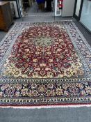 A Persian burgundy ground carpet, 410 x 282cm. Condition - good