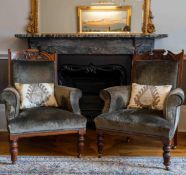 A pair of late Victorian upholstered walnut armchairs, width 73cm, depth 68cm, height 98cm.
