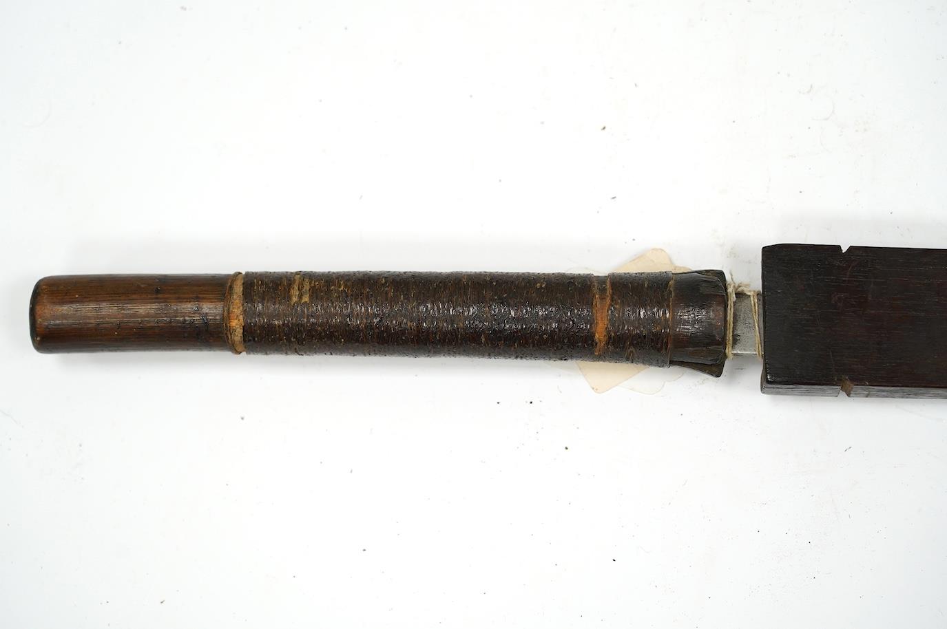 A 19th century Naga sword Dao, rattan bound wooden hilt in its open fronted wooden scabbard, blade - Image 5 of 6