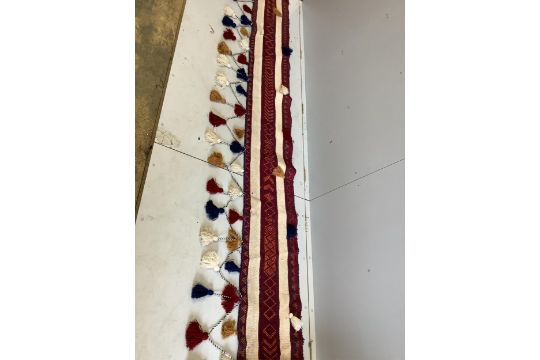 An Anatolian fringed wall hanging, 360 x 73cm. Condition - good - Image 1 of 2