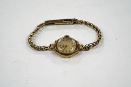 A lady's 9ct gold Omega manual wind wrist watch, on an associated 9ct bracelet, gross weight 12.8