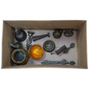 A group of Tibetan brass and mixed metal artefacts to include a brass vase with cabochon inset