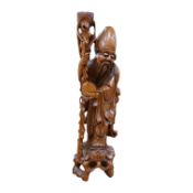 An early 20th century Chinese carved hardwood figure of Shou Lao, mounted as a lamp base, 55cm high.