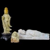 A carved stone reclining buddha, a Chinese deity and a seated buddha, largest 20cm wide. Condition -
