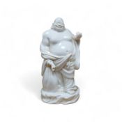 A Chinese blanc de chine figure of Budai, 18cm high. Condition - fair to good