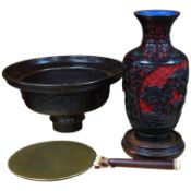 A Chinese bronze bowl, 17cm diameter, a lacquer vase, 15cm high, and a Chinese hand mirror with