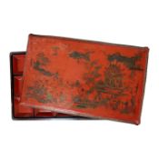 A Chinese rectangular red lacquer supper set containing fifteen small trays, Ming Dynasty, 50cm