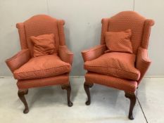 A pair of 1930's Queen Anne Revival walnut armchairs, width 78cm, height 107cm. Condition - slight