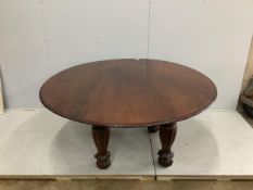 An Indian padouk wood circular top dining table, diameter 152cm, height 74cm. Condition - table