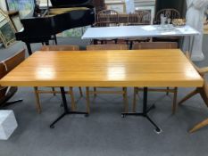 In the manner of Charlotte Perriand, a mid century rectangular maple dining table on twin three