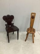 An early Victorian mahogany hall chair and a Continental inlaid oak spinning chair. Condition - both