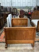 A 19th century French carved walnut sleigh bed, width 130cm, length 202cm, height 100cm. Condition -