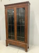 A 19th century French brass mounted mahogany bookcase, width 112cm, depth 32cm, height 195cm.