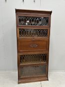 Attributed to Globe Wernicke, an oak five section bookcase incorporating secretaire compartment,