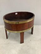 A Victorian brass bound oak wine cooler/jardiniere, width 60cm, depth 44cm, height 55cm. Condition -