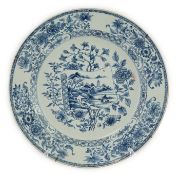 A Chinese blue and white 'scroll and blossom' charger, Qianlong period, the centre painted with a