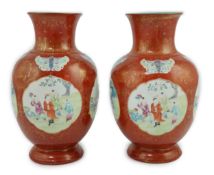 A pair of Chinese coral ground ‘boys’ vases, Jiaqing period (1796-1820), painted with boys playing