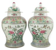 A pair of large Chinese famille rose baluster jars and covers, Qianlong seal mark, but late 19th