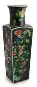 A large Chinese famille noire square baluster vase, 19th century in Kangxi style, painted to each