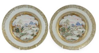 A pair of Chinese famille rose ‘landscape’ plates, Yongzheng-Qianlong period, each finely painted