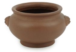 A Chinese Yixing censer, 19th century, the compressed globular body applied with a pair of lion mask