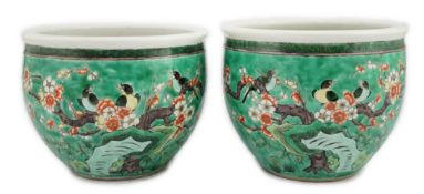 A pair of Chinese famille verte green ground jardinieres, Kangxi marks, but late 19th century,