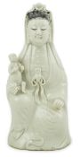 A Chinese white glazed group of Guanyin and child, 18th/19th century, 20.5cm high PLEASE NOTE:-