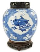 A Chinese blue and white ovoid jar, Kangxi period (1662-1722), painted with Antiques to petal