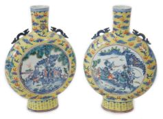 A pair of impressive Chinese yellow ground moonflasks, late 19th century, each painted in underglaze