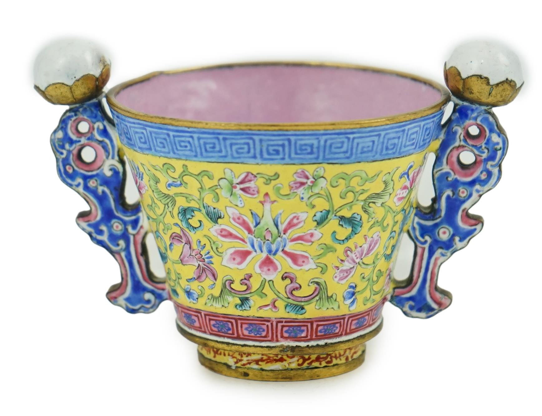 A Chinese Guangzhou enamel two handled wine cup, four character Qianlong mark and of the period (