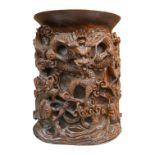 A 20th century Chinese carved hardwood ‘dragon’ brush pot, 22.5cm high. Condition - fair to good