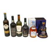 A bottle of Bells Old Scotch whisky, two bottles of port, one bottle of Dalwhinnie whisky and Rio