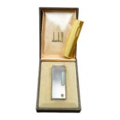 Two Dunhill Rollalite lighters, gold plated and silver, gold plated 7 cm high, Condition - fair to