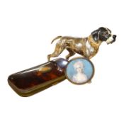 An enamelled silver plated model of a hound, tortoiseshell cigar case and watercolour miniature of a