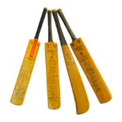 Four miniature model cricket bats, one signed, others printed. Longest 31cm. Condition - fair to